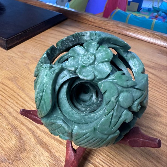 Carved jade puzzle ball on stand